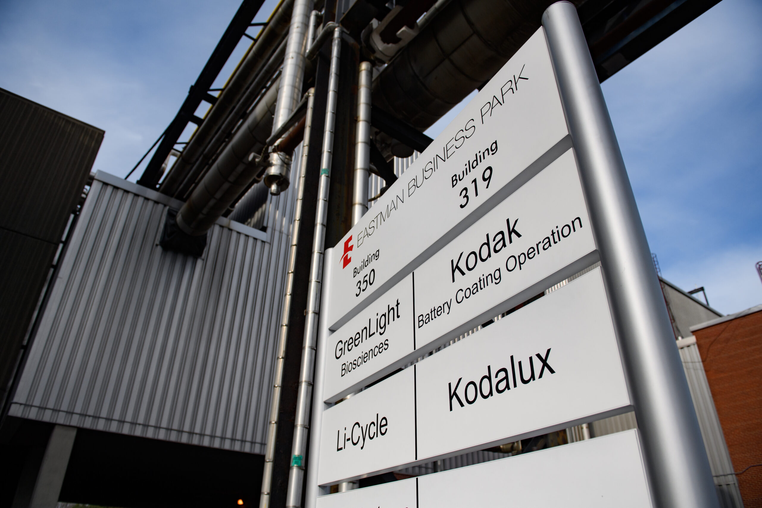 a large sign shows company names at Rochester business park