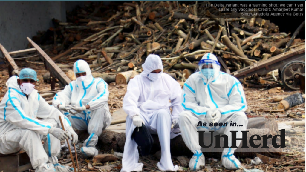 some people in hazmat suits rest after a hard day's work