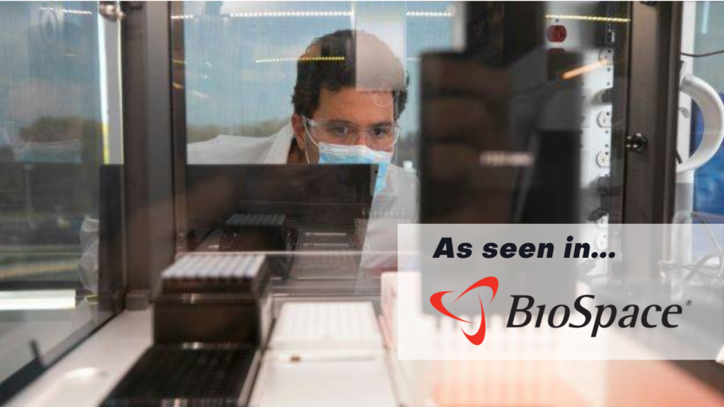 A scientist looks into a screen in a lab